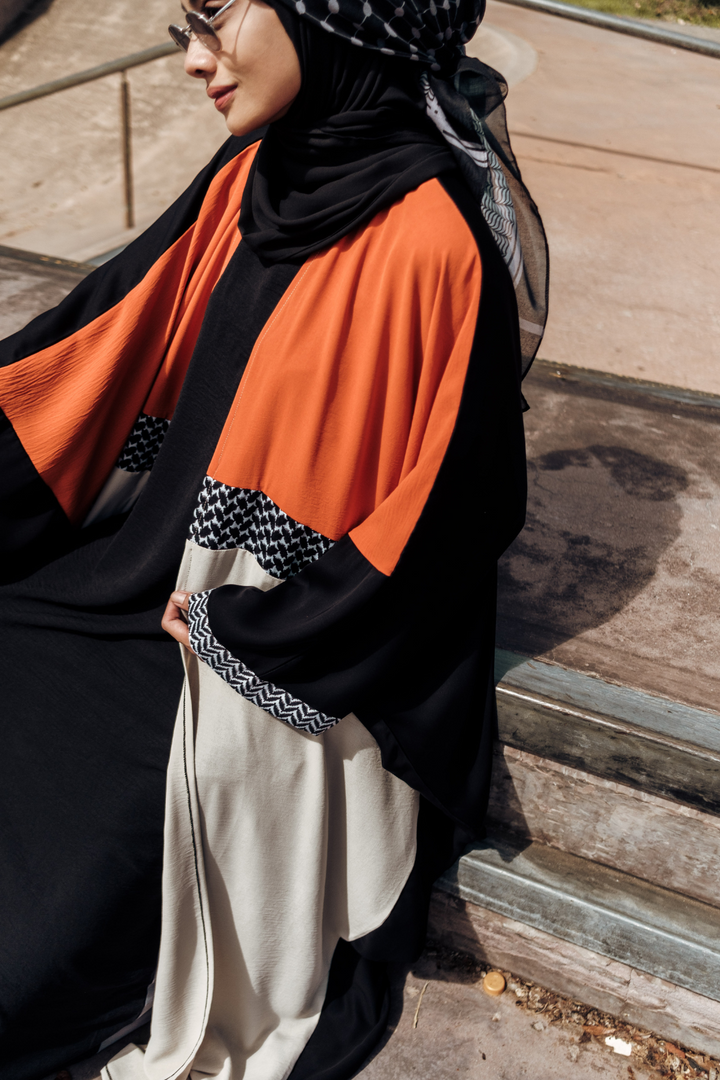 Muslimah model in Singapore wearing oversized streetwear ghutra keffiyeh batwing open abaya with hijab