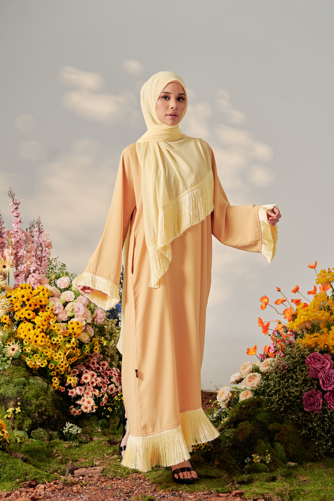 Malaysian model muslimah in nidha abaya with frills on sleeves and hem for Eid 2023